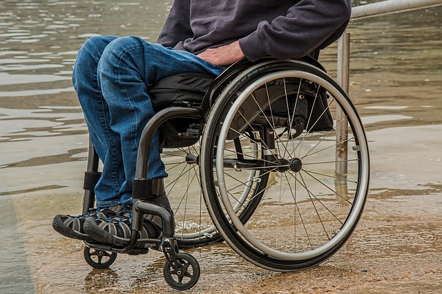 Man in wheelchair by the water